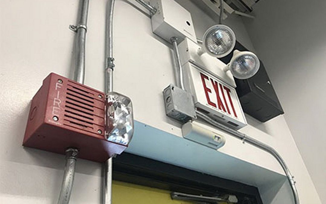 Emergency exit sign above door with generator lights