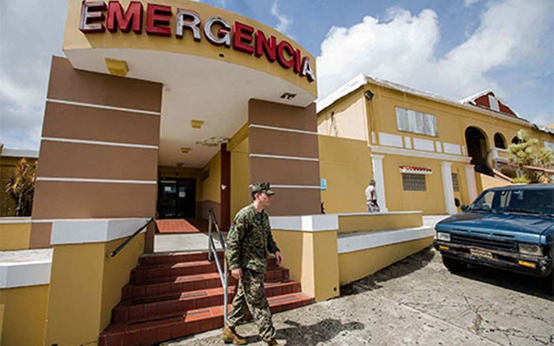 Serviceman leaving an Emergency entrance to a hospital