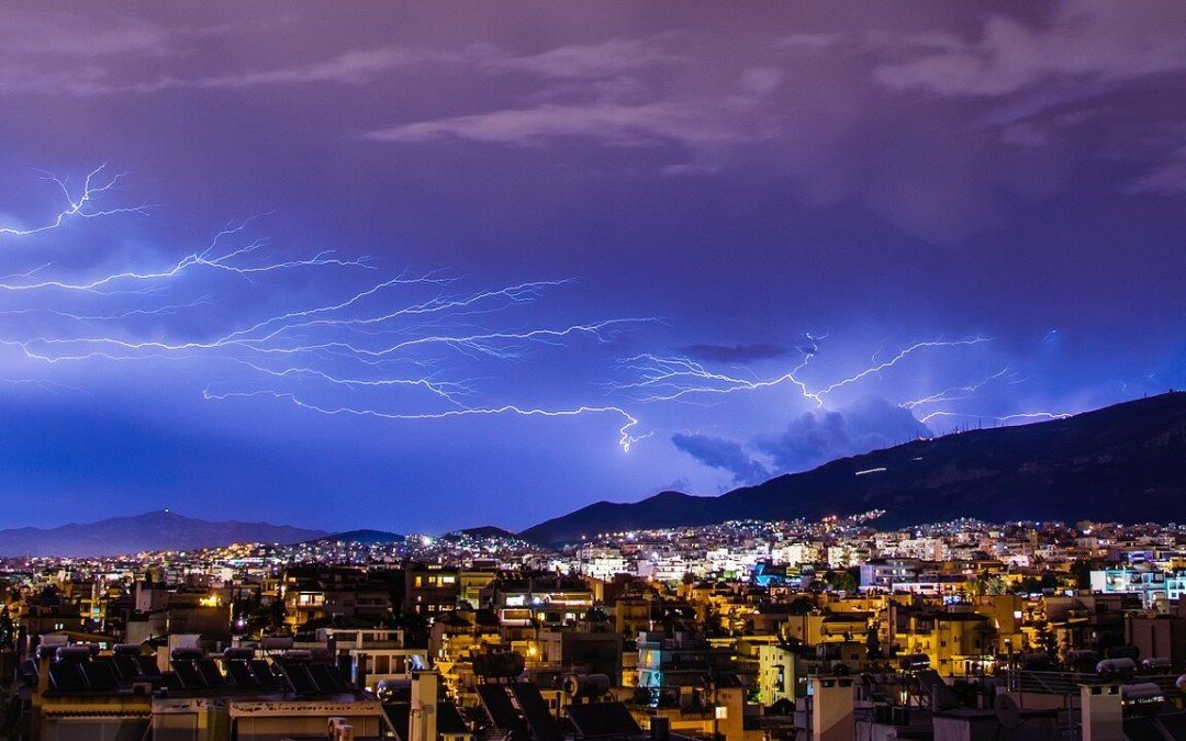 Lightening strikes during thunderstorm at dusk