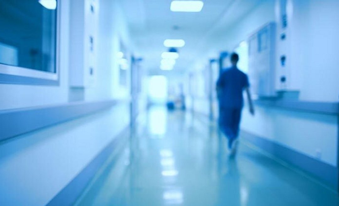 Blurred hospital hallway with provider